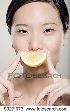 Stock Photo - woman with lemon 
slice smile. fotosearch 
- search stock 
photos, pictures, 
images, and photo 
clipart