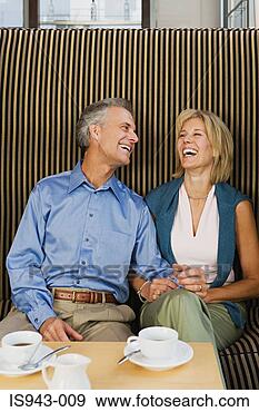 Stock Photograph - happy couple having 
coffee. fotosearch 
- search stock 
photos, pictures, 
images, and photo 
clipart