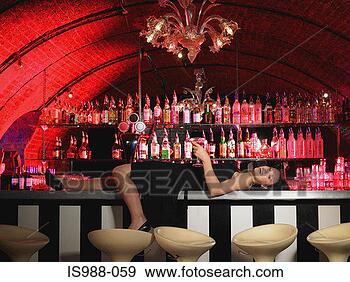 Stock Photograph - woman lying on 
bar. fotosearch 
- search stock 
photos, pictures, 
images, and photo 
clipart