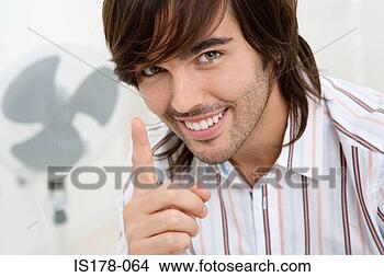 Stock Photo - young man with 
an idea. fotosearch 
- search stock 
photos, pictures, 
images, and photo 
clipart