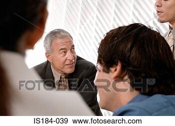 Stock Photograph - men in a meeting. 
fotosearch - search 
stock photos, 
pictures, images, 
and photo clipart