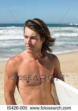 Stock Image - surfer by the 
sea. fotosearch 
- search stock 
photos, pictures, 
images, and photo 
clipart