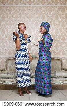 Stock Photograph - two women in traditional 
clothing. fotosearch 
- search stock 
photos, pictures, 
images, and photo 
clipart