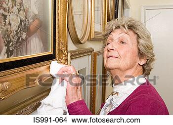 Stock Photo - woman polishing 
picture frames. 
fotosearch - search 
stock photos, 
pictures, images, 
and photo clipart