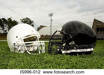 Stock Photo - black and white 
football helmets. 
fotosearch - search 
stock photos, 
pictures, images, 
and photo clipart