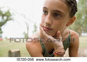 Stock Photo - bored looking 
girl in a field. 
fotosearch - search 
stock photos, 
pictures, images, 
and photo clipart