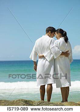 Stock Photograph - couple wearing 
bathrobes on beach. 
fotosearch - search 
stock photos, 
pictures, images, 
and photo clipart
