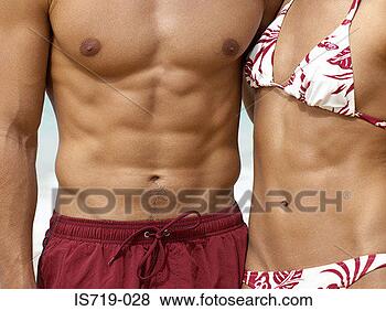 Stock Photo - healthy couple 
wearing swimwear. 
fotosearch - search 
stock photos, 
pictures, images, 
and photo clipart