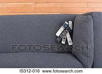 Stock Photo - remote controls 
on a sofa. fotosearch 
- search stock 
photos, pictures, 
images, and photo 
clipart