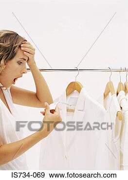 Stock Photograph - woman shocked 
at price in clothes 
shop. fotosearch 
- search stock 
photos, pictures, 
images, and photo 
clipart