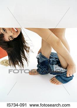 Stock Photography - woman trying on 
jeans. fotosearch 
- search stock 
photos, pictures, 
images, and photo 
clipart
