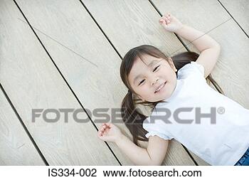 Stock Photo - asian girl lying 
on the floor. 
fotosearch - search 
stock photos, 
pictures, images, 
and photo clipart