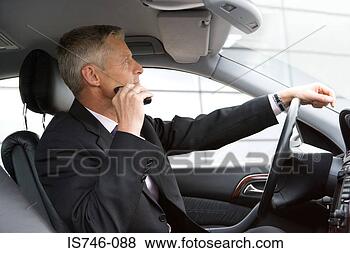 Stock Photo - man shaving with 
electric razor 
in car. fotosearch 
- search stock 
photos, pictures, 
images, and photo 
clipart