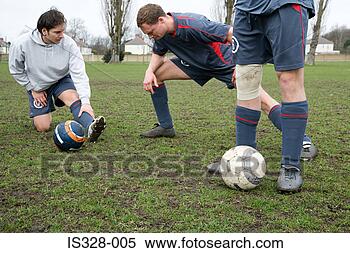 Stock Image - footballers warming 
up. fotosearch 
- search stock 
photos, pictures, 
images, and photo 
clipart