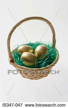 Picture - golden eggs in 
a basket. fotosearch 
- search stock 
photos, pictures, 
images, and photo 
clipart
