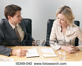 Stock Photography - colleagues discussing 
idea. fotosearch 
- search stock 
photos, pictures, 
images, and photo 
clipart