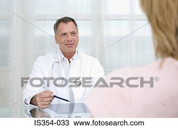 Stock Photo - doctor giving 
consultation. 
fotosearch - search 
stock photos, 
pictures, images, 
and photo clipart