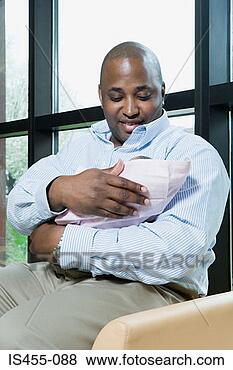 Stock Photo - father with new 
baby. fotosearch 
- search stock 
photos, pictures, 
images, and photo 
clipart