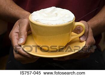 Stock Image - person holding 
hot chocolate. 
fotosearch - search 
stock photos, 
pictures, images, 
and photo clipart