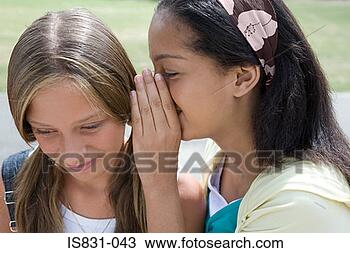 Stock Photo - girls whispering. 
fotosearch - search 
stock photos, 
pictures, images, 
and photo clipart