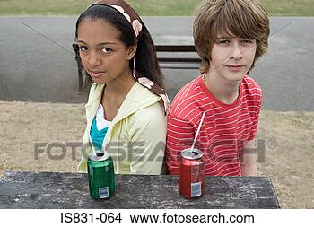 Stock Photo - teenage boy and 
girl with drinks. 
fotosearch - search 
stock photos, 
pictures, images, 
and photo clipart