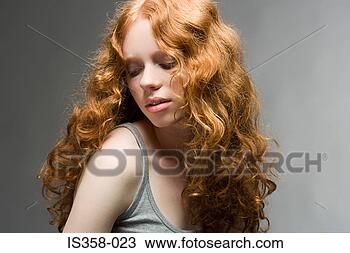 Stock Photo - woman with curly 
red hair. fotosearch 
- search stock 
photos, pictures, 
images, and photo 
clipart