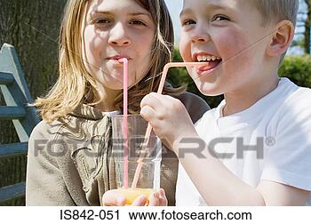 Stock Photography - boy and girl sharing 
drink. fotosearch 
- search stock 
photos, pictures, 
images, and photo 
clipart
