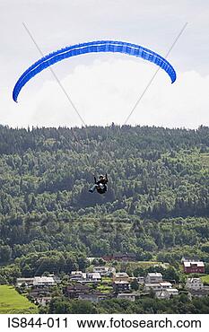 Stock Photography - blue parachute 
over town. fotosearch 
- search stock 
photos, pictures, 
images, and photo 
clipart