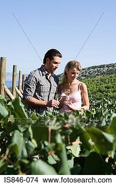 Stock Photo - couple looking 
at vineyard. fotosearch 
- search stock 
photos, pictures, 
images, and photo 
clipart