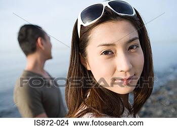 Stock Photo - woman in sunglasses 
with man. fotosearch 
- search stock 
photos, pictures, 
images, and photo 
clipart