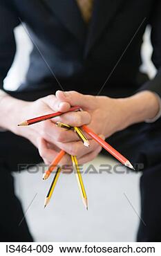 Arquivo Fotográficos - mulher,  segurando, 
 lápis. fotosearch 
- busca de fotos, 
imagens e clipart