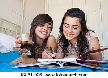 Stock Photo - friends writing 
in a book. fotosearch 
- search stock 
photos, pictures, 
images, and photo 
clipart