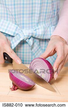 Stock Photography - person chopping 
a red onion. fotosearch 
- search stock 
photos, pictures, 
images, and photo 
clipart