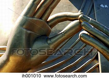 Stock Photography - close-up on the 
fingers of a golden 
statue. fotosearch 
- search stock 
photos, pictures, 
images, and photo 
clipart