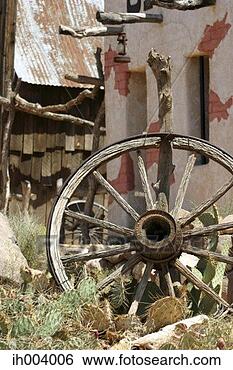 Stock Photo - broken wheel and 
cactus plants. 
fotosearch - search 
stock photos, 
pictures, images, 
and photo clipart