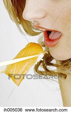 Stock Photo - woman eating japanese 
food. fotosearch 
- search stock 
photos, pictures, 
images, and photo 
clipart