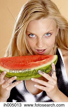 Stock Photo - woman eating water-melon. 
fotosearch - search 
stock photos, 
pictures, images, 
and photo clipart