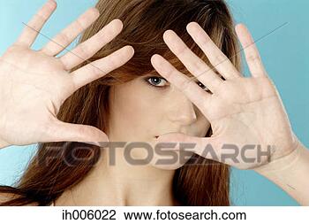 Stock Photo - camera shy woman. 
fotosearch - search 
stock photos, 
pictures, images, 
and photo clipart