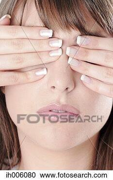 Stock Photography - woman covering 
her eyes with 
her hands. fotosearch 
- search stock 
photos, pictures, 
images, and photo 
clipart