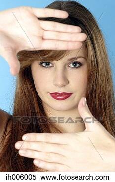 Stock Image - woman making a 
square with her 
fingers. fotosearch 
- search stock 
photos, pictures, 
images, and photo 
clipart