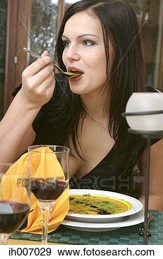 Stock Photograph - woman enjoying 
a bowl of soup. 
fotosearch - search 
stock photos, 
pictures, images, 
and photo clipart