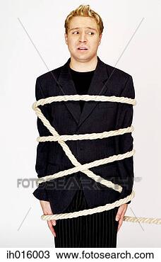 Stock Photo - businessman being 
tied up with rope. 
fotosearch - search 
stock photos, 
pictures, images, 
and photo clipart