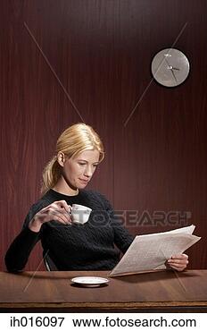 Picture - businesswoman 
drinking coffee 
while reading 
newspaper. fotosearch 
- search stock 
photos, pictures, 
images, and photo 
clipart