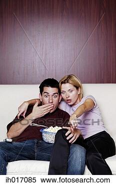 Stock Image - couple watching 
movie at home. 
fotosearch - search 
stock photos, 
pictures, images, 
and photo clipart