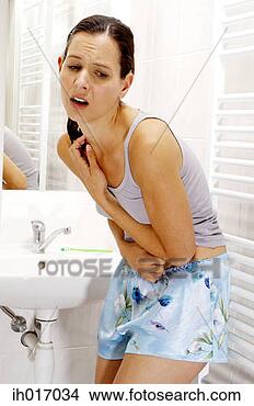 Stock Photo - woman having stomachache. 
fotosearch - search 
stock photos, 
pictures, images, 
and photo clipart