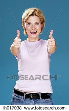 Stock Photo - woman showing 
double thumbs 
up. fotosearch 
- search stock 
photos, pictures, 
images, and photo 
clipart