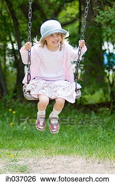 Stock Photo - girl sitting on 
swing. fotosearch 
- search stock 
photos, pictures, 
images, and photo 
clipart