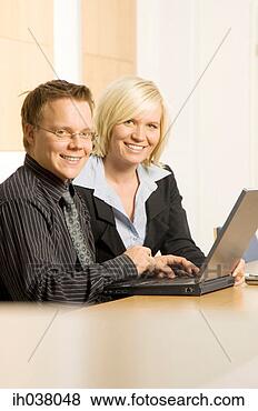 Stock Photo - businessman and 
businesswoman 
working together. 
fotosearch - search 
stock photos, 
pictures, images, 
and photo clipart