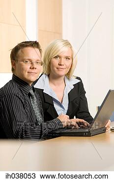 Stock Photo - businessman and 
businesswoman 
working together. 
fotosearch - search 
stock photos, 
pictures, images, 
and photo clipart