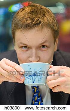 Stock Photography - businessman drinking 
a cup of coffee. 
fotosearch - search 
stock photos, 
pictures, images, 
and photo clipart